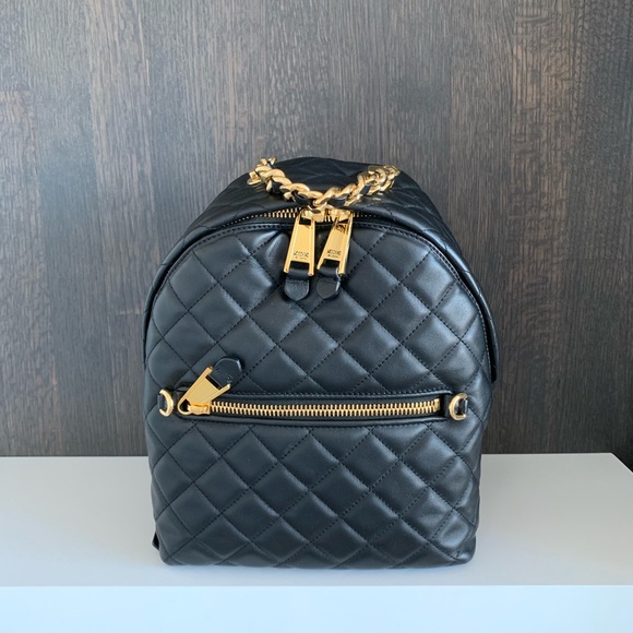 Moschino Handbags - Moschino Black Leather Quilted Backpack
